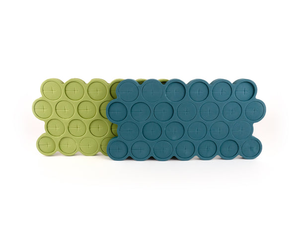 26 bright-green foam stem collars in mold, on top of 26 teal foam stem collars in mold.